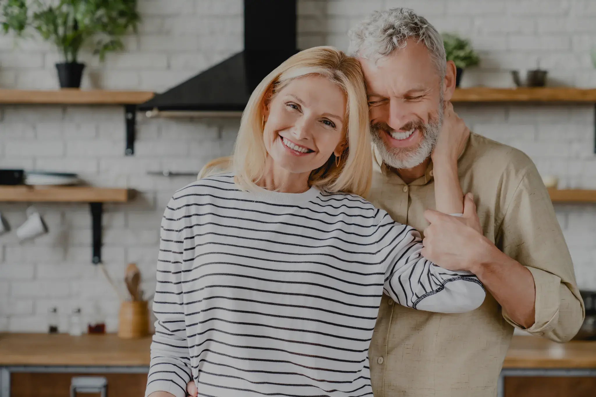 happy-middle-aged-couple-embracing-at-home-kitchen-2025-01-09-03-22-25-utc-3 (1) (1)